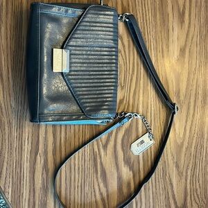 Gray crossbody Rosetti Go purse.